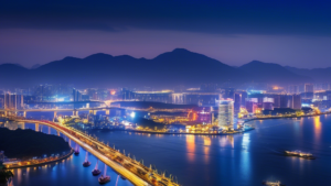 A panoramic cityscape of Da Nang, Vietnam, showcasing its modern skyline, the Han River, and iconic bridges, surrounded by lush mountains and sparkling blu