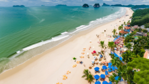 A vibrant aerial view of the renowned Sầm Sơn beach in Thanh Hóa, Vietnam, showcasing its pristine coastline, crystal-clear waters, and bustling resorts.